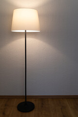 Floor lamp in the room on a brown wooden floor