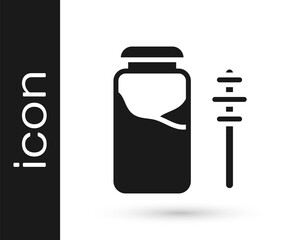 Black Jar of honey and honey dipper stick icon isolated on white background. Food bank. Sweet natural food symbol. Honey ladle. Vector