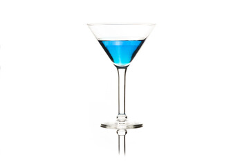 Martini glasses isolated on white with blue drink in one glass