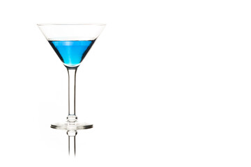 Martini glasses isolated on white with blue drink in one glass