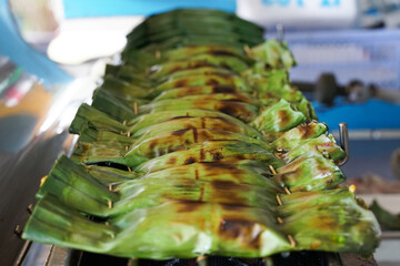 hor-mok thai tradition food,  Thai Curried Mousse Fish Custard recipe on top with crab meat is steamed fish curry in banana leaves calls Haw Mok.