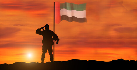 Silhouette Of A Solider Saluting Against the flag of UAE. Concept of national muslim holidays. Independence Day, Victory Day.