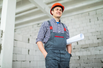 repair, construction and building concept - happy smiling male worker or builder in helmet with...