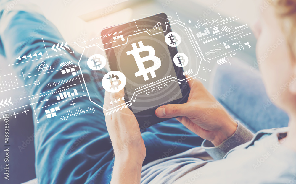 Aufkleber bitcoin with man using a tablet