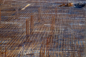 Fototapeta premium Billets of reinforcement at the construction site. New construction. Reinforced concrete construction.