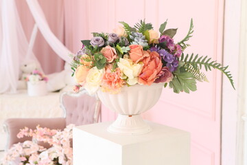 Artificial bouquet of flowers in the interior of a vintage room