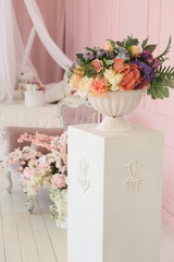 Artificial bouquet of flowers in the interior of a vintage room