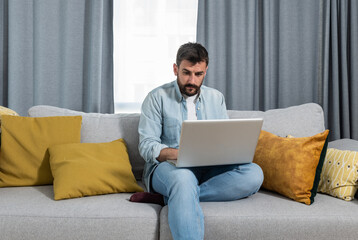 Young psychotherapist working at home in his home office as free online therapy doctor for people...