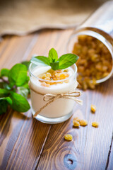 sweet homemade yogurt with raisins in a glass