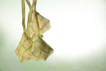 Fototapeta na wymiar Ketupat is a traditional food during Eid. a natural rice container made from young coconut leaves to cook rice.