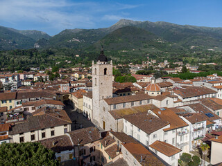 Fototapeta na wymiar Camaiore, Lucca, Italy: aerial view of city center with Collegiate Church of Santa Maria Assunta and its bell tower