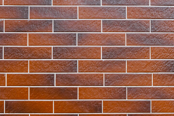 Minimalist textured monochrome background of old red brown bricks in horizontal display.