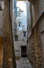 Fototapeta premium A narrow street with cobblestone road of charming old town Saint Paul de Vence in Provence, France.