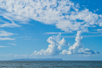 Naklejka na ściany i meble Ni'ihau island off the coast of Kauai, Hawaii and blue sky and clouds