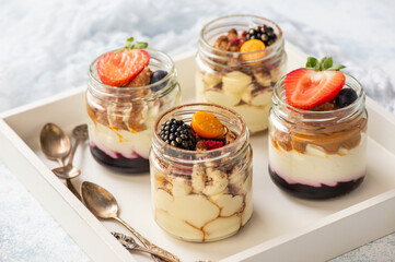 Homemade tiramisu dessert in glass jars.