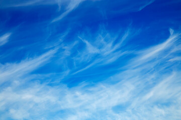 Feathered clouds in blue spring sky
