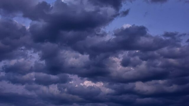 4K Time lapse, Dark grey clouds rolling floating in the sky. Concept Storm Clouds Raining.