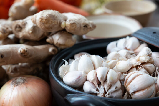 Fresh garlic in bowl, ginger and Vegetable in bowl for making kimchi. Mixed raw vegetables in traditional bowl used for cooking and making preserved food.