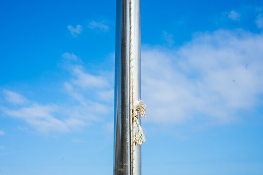 Rope Knot On Silver Pole With Blue Sky