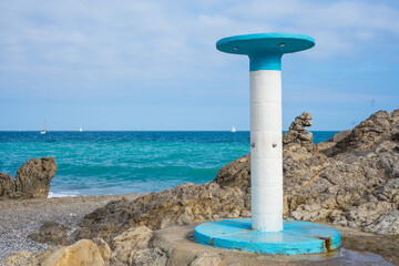 white and blue beach shower typical of beach