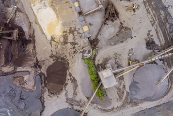 The dumpers and machines are working in the quarry mine for special equipment