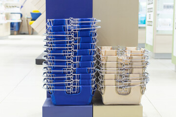A Stack of baskets for the shopper in the store