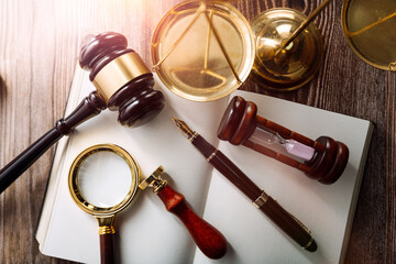 Business and lawyers discussing contract papers with brass scale on desk in office. Law, legal...