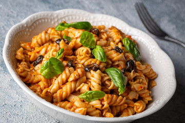 Basil leaves on pasta with arabiata sauce