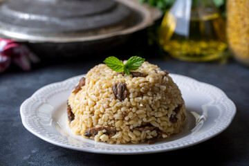 Turkish foods; Bulgur pilaf with mushrooms (Turkish name; mantarli bulgur pilavi)
