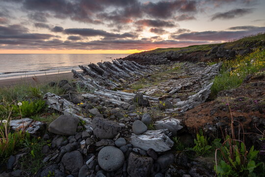 boat wreck; boat skeleton; old; drakar; viking boat; atlantic ocean; north; iceland; northern sea route; fjords; gulfstream; warm sea current; global warming; ocean; sunrise; beach; travel; horizon; a
