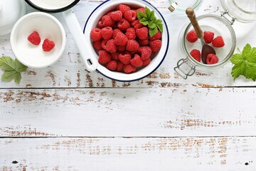 Fresh raspberry on white wooden table. Flat layot, copy space	