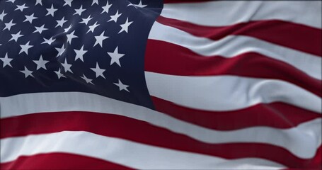 close up view of the american flag waving in the wind. - Powered by Adobe