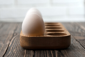 White egg on a wooden table