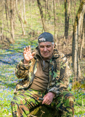 Fototapeta premium Elderly man on a walk in the woods