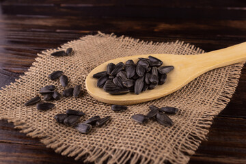 fried seeds in a wooden spoon and scattered