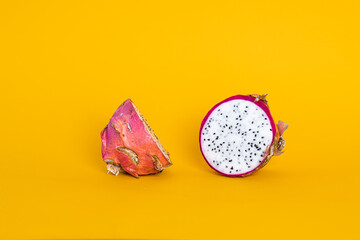 Dragon fruit or pitahaya isolated on yellow background 