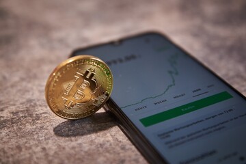 Trading cryptocurrencies on a smartphone. Crypto trading app.