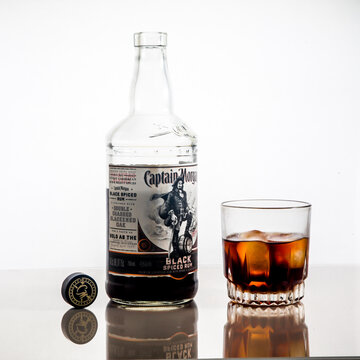 Bottle With Captain Morgan Black Spiced Rum And Glass