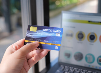 woman using a credit card for Online shopping on website.