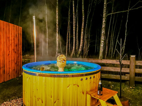 The Girl Is Bathing And Relaxing In A Hot Tub At Night