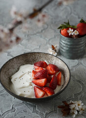 yogurt with strawberries and flowers