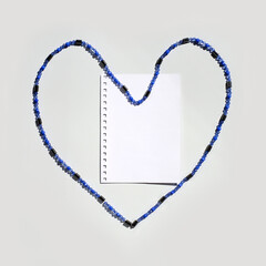 Fototapeta na wymiar Note paper blank on fridge with shape heart magnet, square image