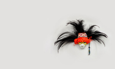 Fridge magnet venetian mask, traditional souvenir. Copy space