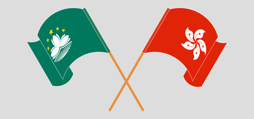 Crossed and waving flags of Macau and Hong Kong