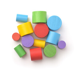 Top view of colorful wooden toy cylinders