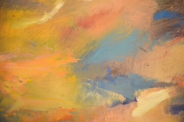 Close up detail of brushstrokes in acrylic and oil paint on an artist's palette.
