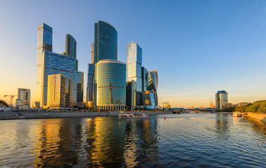 Fototapeta premium Skyscrapers of Moscow City business center and Moscow river in Moscow at sunset, Russia