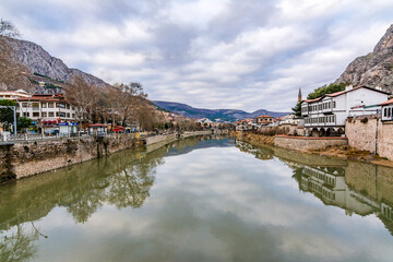 Old Ottoman houses panoramic view by the Yesilirmak River in Amasya City. Amasya is populer tourist destination in Turkey.