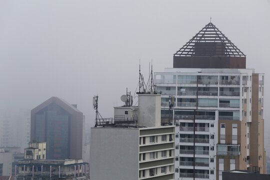 Dense fog cover the city of Sao Paulo, downtown district, Brazil, during early morning.