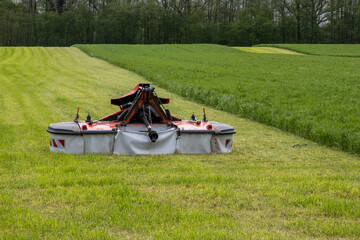 Mower conditioner on a partially mown pasture